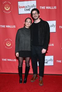 BEVERLY HILLS, CALIFORNIA - NOVEMBER 29: (L-R) LA Thoma and Grant Gustin attend the Los Angeles premiere of "Love Actually Live" at Wallis Annenberg Center for the Performing Arts on November 29, 2023 in Beverly Hills, California. (Photo by Michael Tullberg/Getty Images)