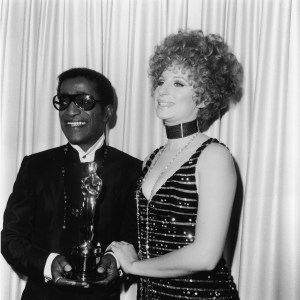 American singer and actor Sammy Davis Jr. (1925 - 1990) poses with Barbra Streisand, holding the Oscar for Best Song, at the Academy Awards ceremony, Santa Monica Civic Auditorium, Santa Monica, California, April 10, 1968. Davis accepted the Oscar on behalf of Leslie Bricusse, who received the award for the song 'Talk to The Animals' from the film, 'Doctor Dolittle.' (Photo by Fotos International/Getty Images)